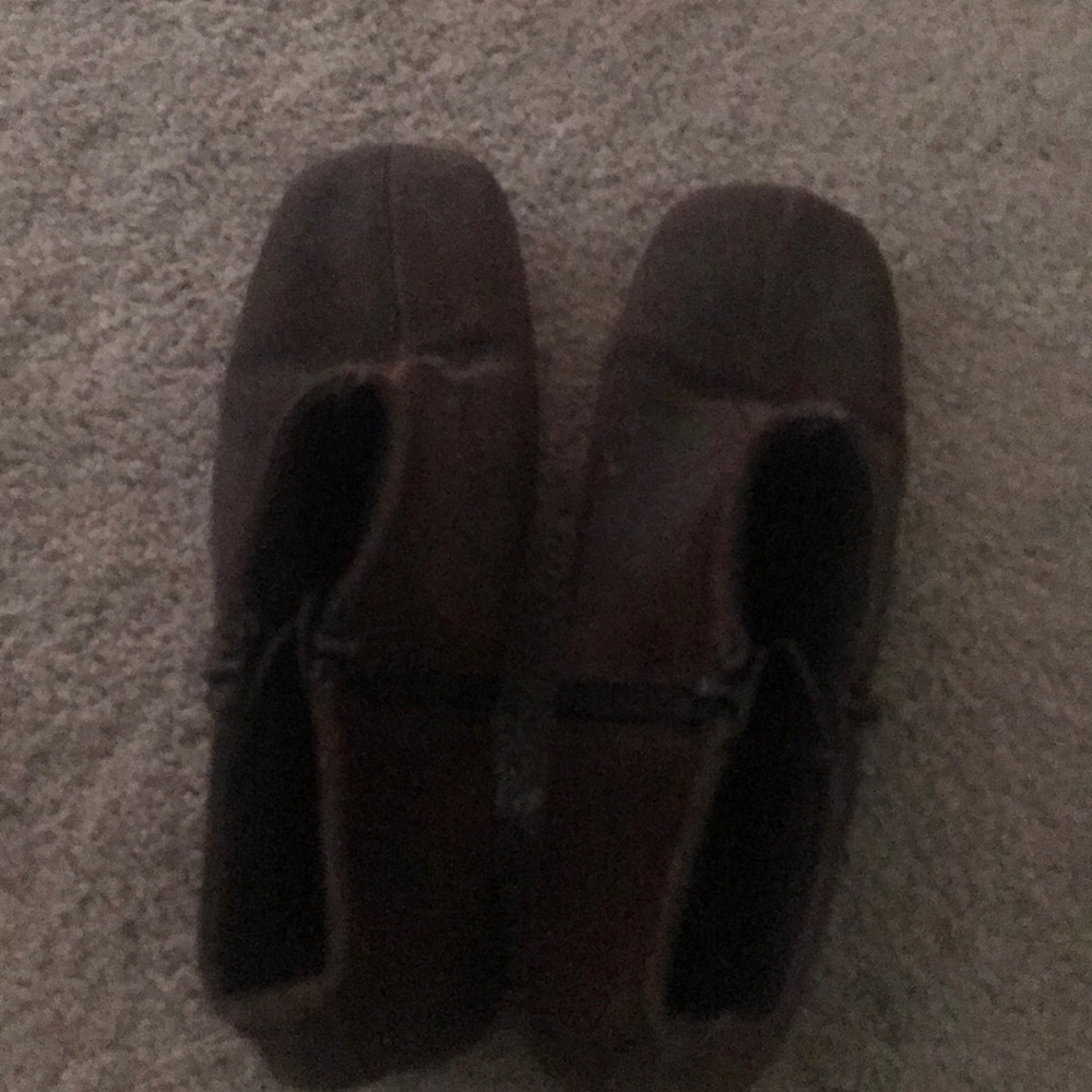 Brown suede ankle-high boots.